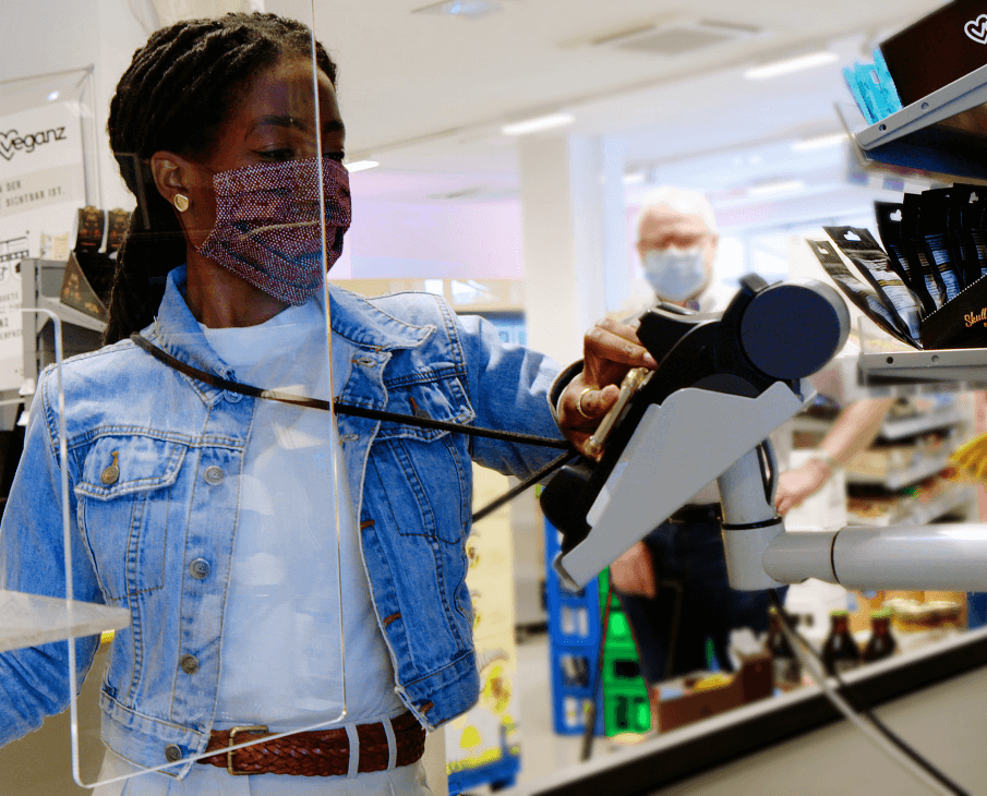 Woman making payment at POS terminal