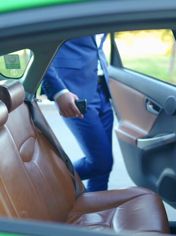 Person getting into car