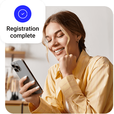 A person using a smartphone with an overlay confirming “Registration Complete.