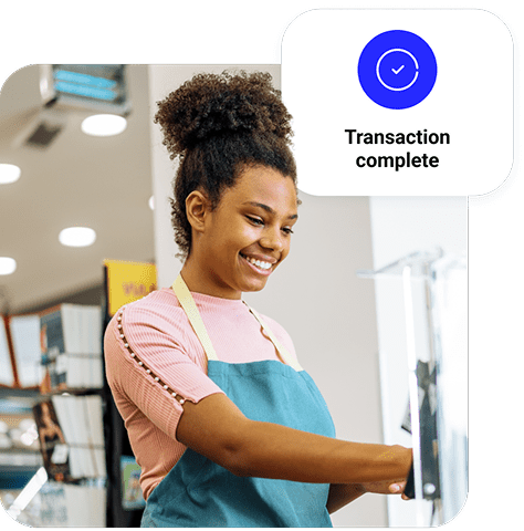 A merchant completes a transaction with their countertop payment tech.