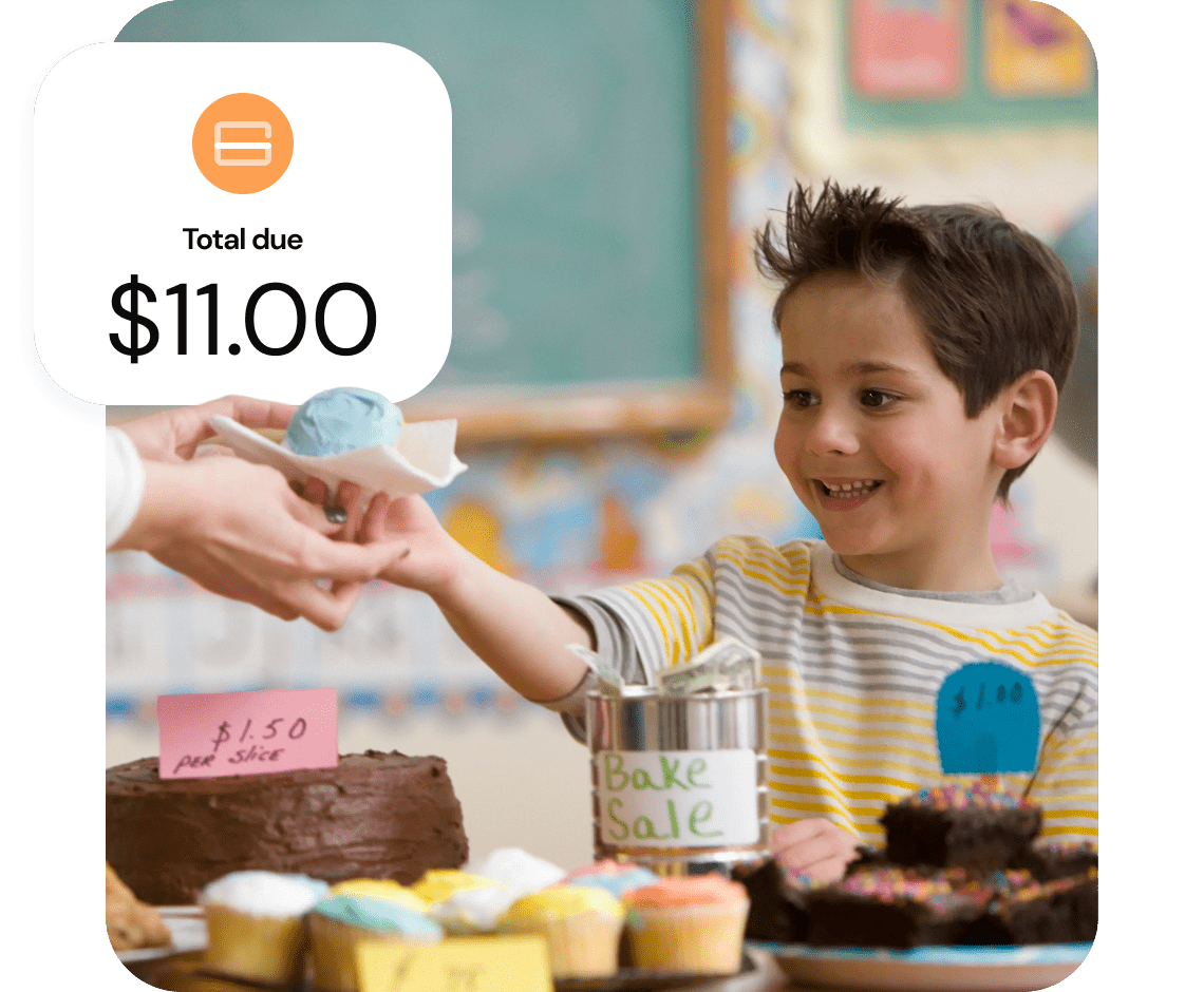 A child working at a bake sale handling a customer a pastry.