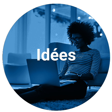 Woman sitting on floor and using laptop (blue overlay)