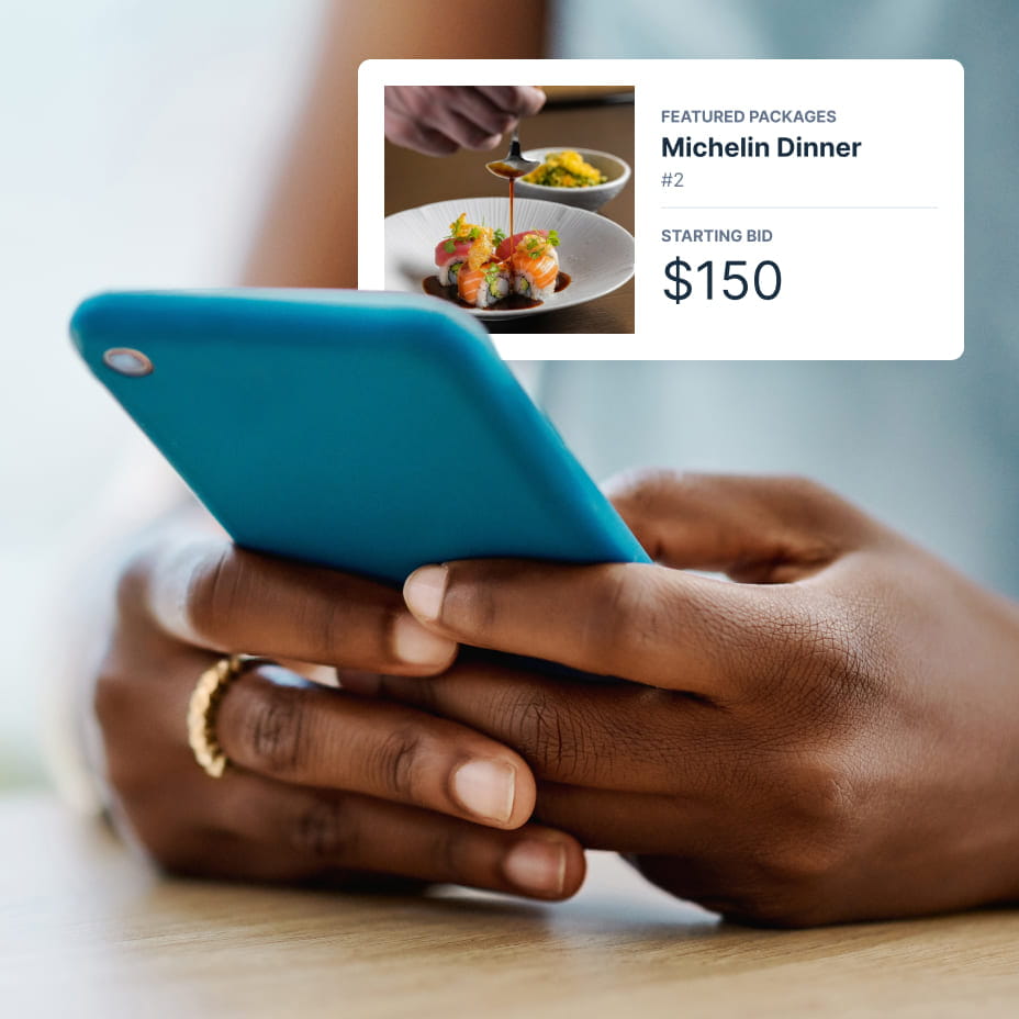 A small white notification of a michelin dinner starting at $150 overlaid a photo of a smartphone in someone’s hands