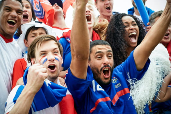 Fans cheering at a sports event