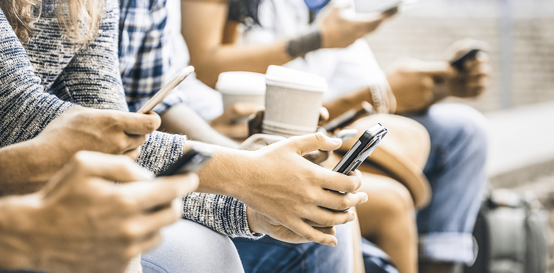 College students using mobile phones.